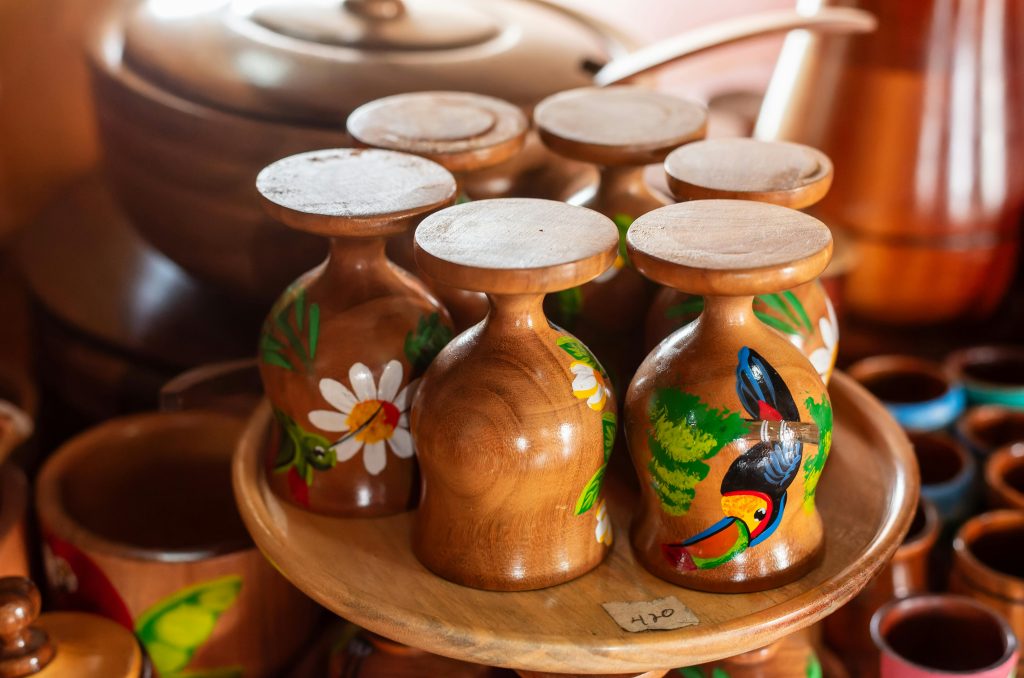 Artistic wooden cups with tropical designs in Masaya, Nicaragua. A showcase of vibrant Nicaraguan craftsmanship.